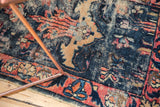 Antique Lilihan rug detail reveals deep blue pile, raspberry rose border, and knot heads from even wear.