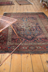 Antique Kurdish Bijar geometric flower patterns in deep red, sky blue, and ivory.
