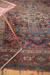 Antique Kurdish Bijar rug detail with geometric floral motifs, blush, sky blue, and a patina of age.
