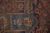 Detail of an antique Kurdish Bijar rug showing tatter, wear, and exposed foundation.