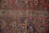Worn pile revealing foundation, geometric patterns, and muted red, blue hues on antique Bijar rug.