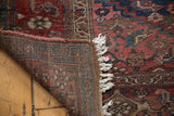 Tightly woven foundation and tattered fringe of an antique Kurdish Bijar rug.