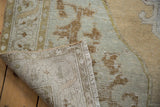 Vintage Distressed Oushak rug showing worn pile, hand-knotted foundation, and fringe.