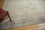 Distressed border of a vintage Oushak rug, showing even wear to knot heads and foundation.