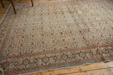 Distressed vintage Turkish Kaisary carpet, showing muted herati patterns and samovar border.