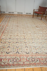Vintage distressed Kaisary carpet showing cherry red samovar border and herati motif.