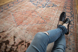 Distressed antique Hamadan runner with low pile and faded blush, blue rectilinear patterns.