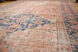 Distressed Hamadan runner with low pile blush, sand, and sky blue rectilinear herati motifs.