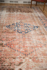 Distressed antique Hamadan runner showing blush, sky blue, and chocolate brown rectilinear patterns.