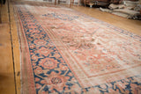 Antique Hamadan runner showing extensive low pile, time-softened blush, blue, brown tones.