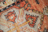 Detail of distressed pile, serrated sickle leaves in brick red, silver gray, charcoal navy.