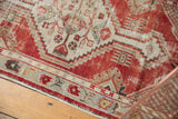 Distressed Oushak runner with textured cherry red, ivory abrash, and primitive floral border.