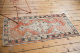 Distressed vintage Oushak runner, hand-knotted with abrash patterns and faded cherry red.