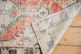 Textured distressed Oushak rug pile with visible original selvage and hand-knotted reverse.