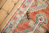 Distressed Oushak runner's original side selvage and abrashed, primitive floral border.