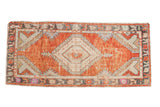 Distressed hand-knotted Oushak rug runner, faded brick red field, central diamond medallion, 2'8