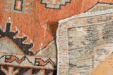 Distressed Oushak runner: faded brick red pile with even wear and hand-knotted reverse.