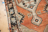 Distressed vintage Oushak rug with abrashed brick red and ivory primitive geometric patterns.