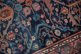 Vintage Lilihan rug border, with navy, raspberry, and sky blue curvilinear motifs.