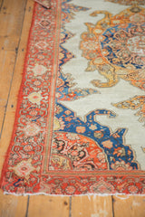 Antique Mission Malayer rug corner with red border, visible hard tatter, ivory field pattern.