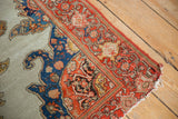 Antique Malayer rug corner with hard tatter, ivory field, and bold blue red border.