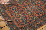 Vintage Mehrivan runner with repeating floral cross-section motif, showing even wear and dusty blush.