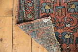 Detail of hand-knotted Mehrivan rug reverse, showing worn dusty blush floral design.