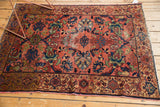 Vintage Malayer rug corner, low pile, dusty blush rose field, oxidized copper green, bronze border.