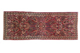 Hand-knotted vintage American Sarouk runner, raspberry red floral field with subtle medallion, 2'6