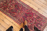 Vintage hand knotted American Sarouk runner, rich with raspberry red and indigo floral motifs.
