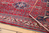 Vintage Bijar rug corner with geometric herati motifs, detailed floral border, and secure blue selvage.