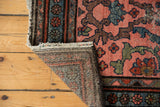 Vintage Mehrivan rug corner folded, showing blush pile, secured side, and woven reverse.
