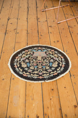 Art Deco round rug curvilinear pattern with blush, sky blue, and sand tones.