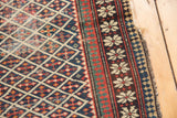 Caucasian Shirvan antique rug detail: unusual pawn design border, red and green stripes, navy lattice field.