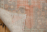 Vintage distressed Oushak rug, showing worn pile, foundation, and reverse number M-81.