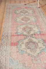 Blush pink, powder blue, and sand distressed pattern on a vintage Oushak runner.