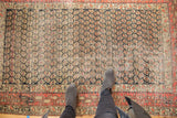 Antique Hamadan rug's allover staggered boteh field, featuring brick red, dark navy charcoal, and ivory hues.