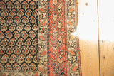 Antique Hamadan rug's main border with brick red boteh paisley and detailed inner designing.