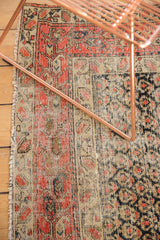 Antique Hamadan rug field, hand-knotted with staggered boteh pattern and time-softened tones.