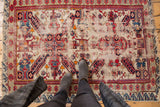 Antique Seichor rug with rare ivory ground, central double medallion, and wave border motif.