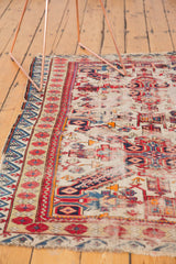 Rare ivory ground, geometric motifs, and reciprocating wave border on this antique Seichor rug.