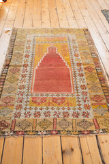 Vintage Turkish Prayer rug with stepped terracotta mihrab and germinating plant motif.