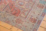Distressed vintage Oushak runner corner, dusty terra cotta and antique ivory geometric patterns.