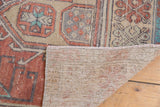 Hand-knotted foundation and moderately worn pile of a vintage Turkish Oushak rug.