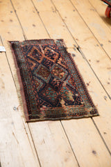 Late 19th century Kurdish fragment showing navy, teal, terracotta diamond motifs and secured end.