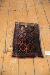 Aged side border of antique Kurdish rug showing geometric patterns and material loss.