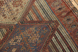 Complex geometric motifs, striped bands, and varied tones on the antique Qashqai rug.