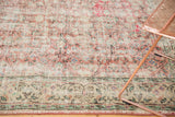 Distressed dusty rose and mint green Oushak field, transitioning to an antique ivory border.