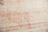 Distressed vintage Oushak carpet texture with mostly even wear, revealing blush rose and cotton white knot heads.