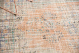 Distressed vintage Oushak carpet with pale apricot, faded blue, mint green, mostly even wear.